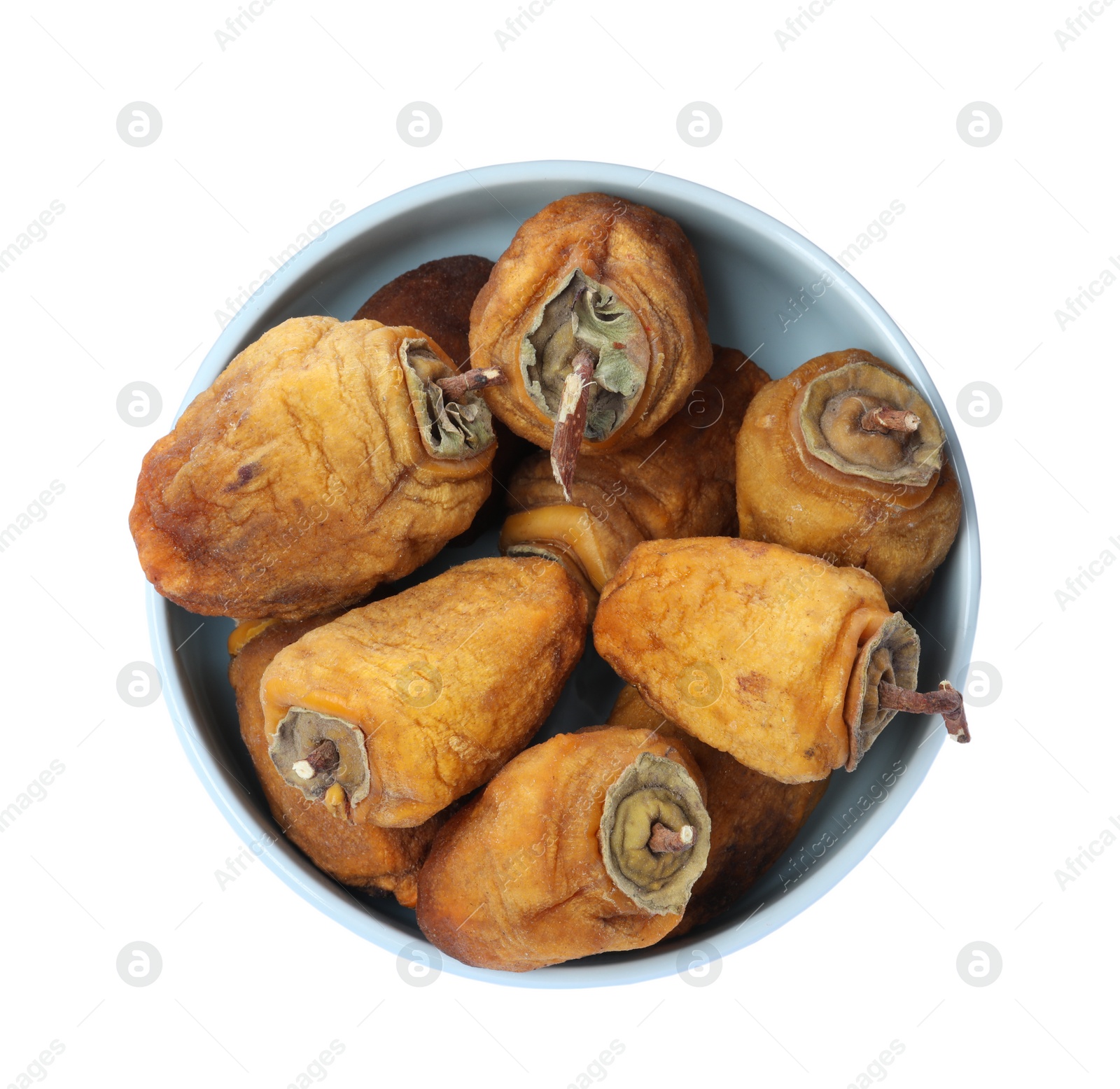 Photo of Tasty dried persimmon fruits in bowl on white background, top view