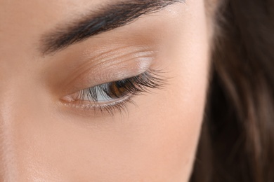 Young woman with beautiful natural eyelashes, closeup view