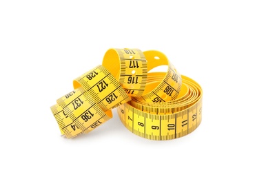 Photo of New yellow measuring tape isolated on white