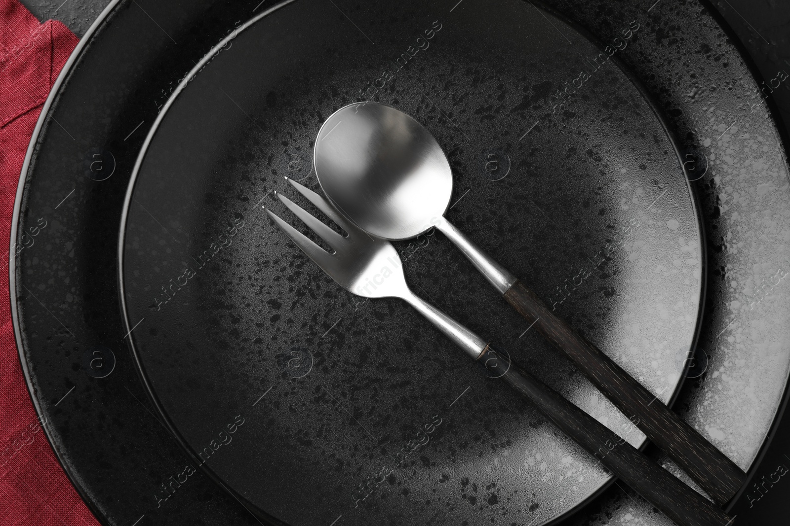 Photo of Stylish setting with cutlery and plates on table, top view