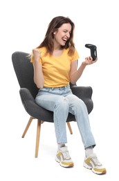 Photo of Happy woman with game controller sitting in armchair on white background