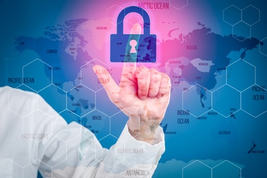 Image of Cyber attack protection. Woman using virtual screen with lock and world map illustrations, closeup