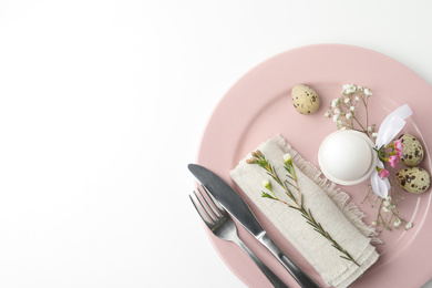 Festive Easter table setting with beautiful floral decor, top view. Space for text