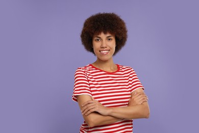 Photo of Portrait of happy young woman on purple background