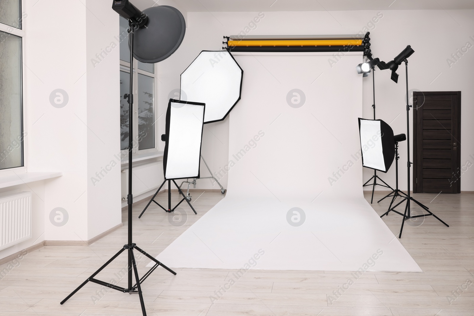 Photo of Stylish photo studio with modern professional equipment