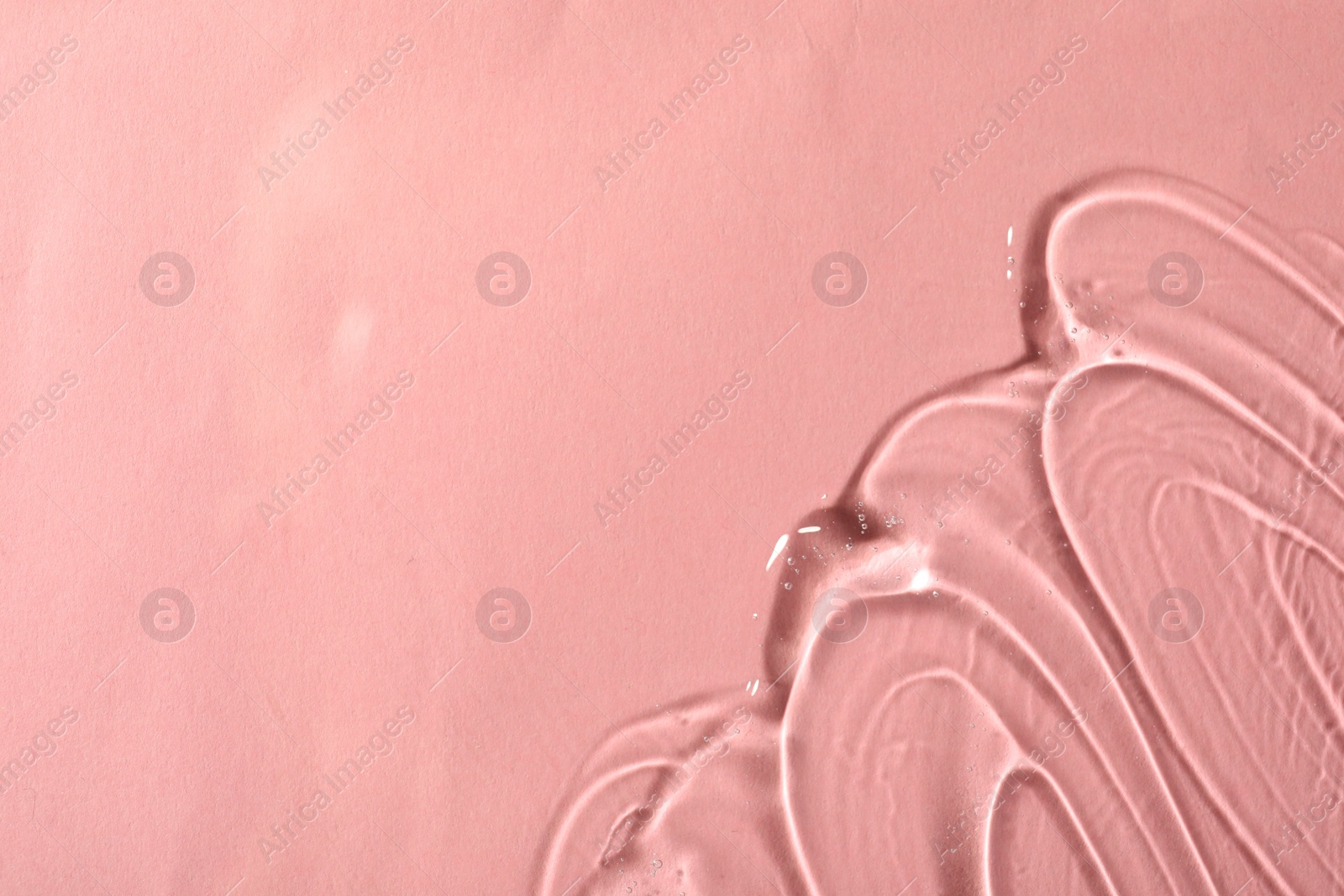 Photo of Cosmetic gel on pink background, top view. Space for text