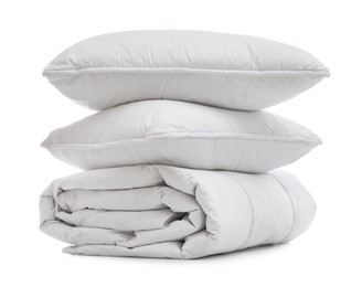 Soft blanket with pillows on white background