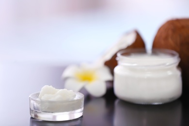 Photo of Composition with coconut butter in glass jar on blurred background