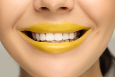 Smiling woman with healthy teeth, closeup view