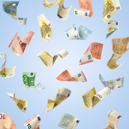 Image of Set of falling money on blue background. Currency exchange