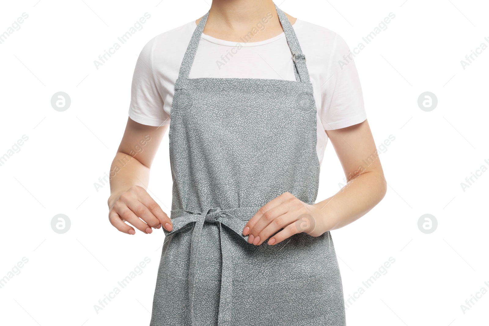 Photo of Woman in clean apron with pattern on white background, closeup