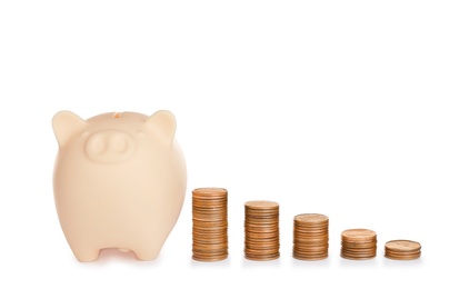 Photo of Piggy bank and different height coin stacks on white background. Space for text