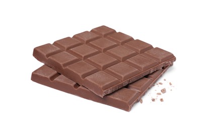 Photo of Pieces of tasty milk chocolate bar isolated on white
