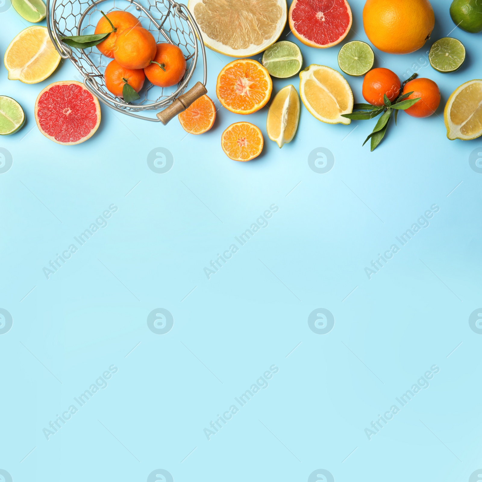 Photo of Different citrus fruits on color background, top view. Space for text