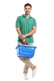 Young man with empty shopping basket isolated on white