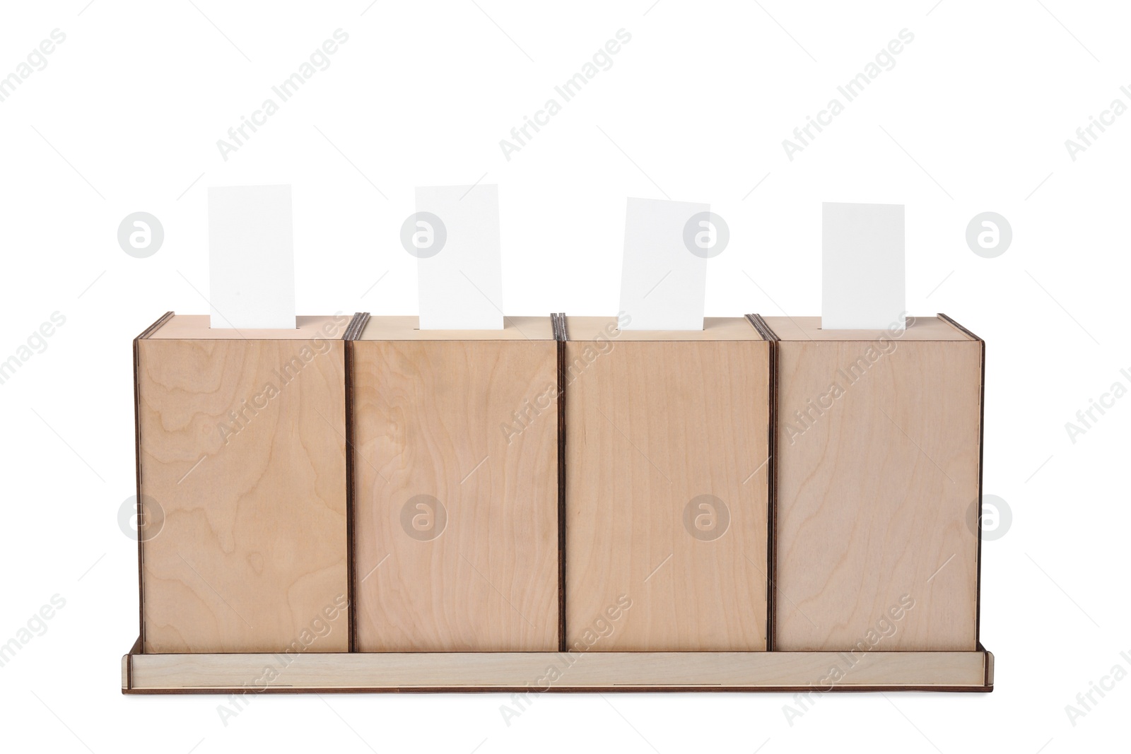 Photo of Wooden ballot boxes with votes isolated on white