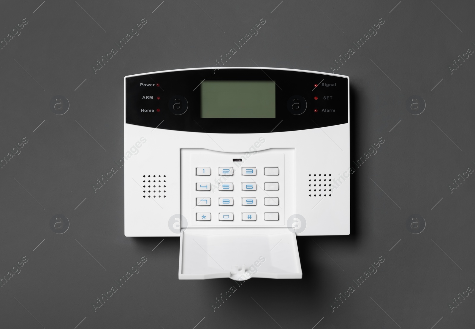 Photo of Home security alarm system on gray wall