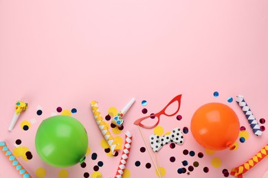 Photo of Flat lay composition with carnival items on pink background. Space for text