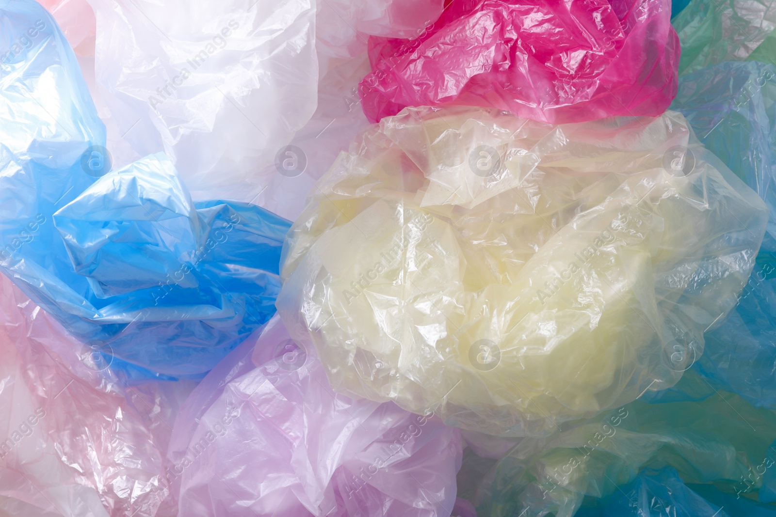 Photo of Many plastic bags as background, top view