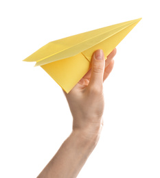 Photo of Woman holding yellow paper plane on white background, closeup