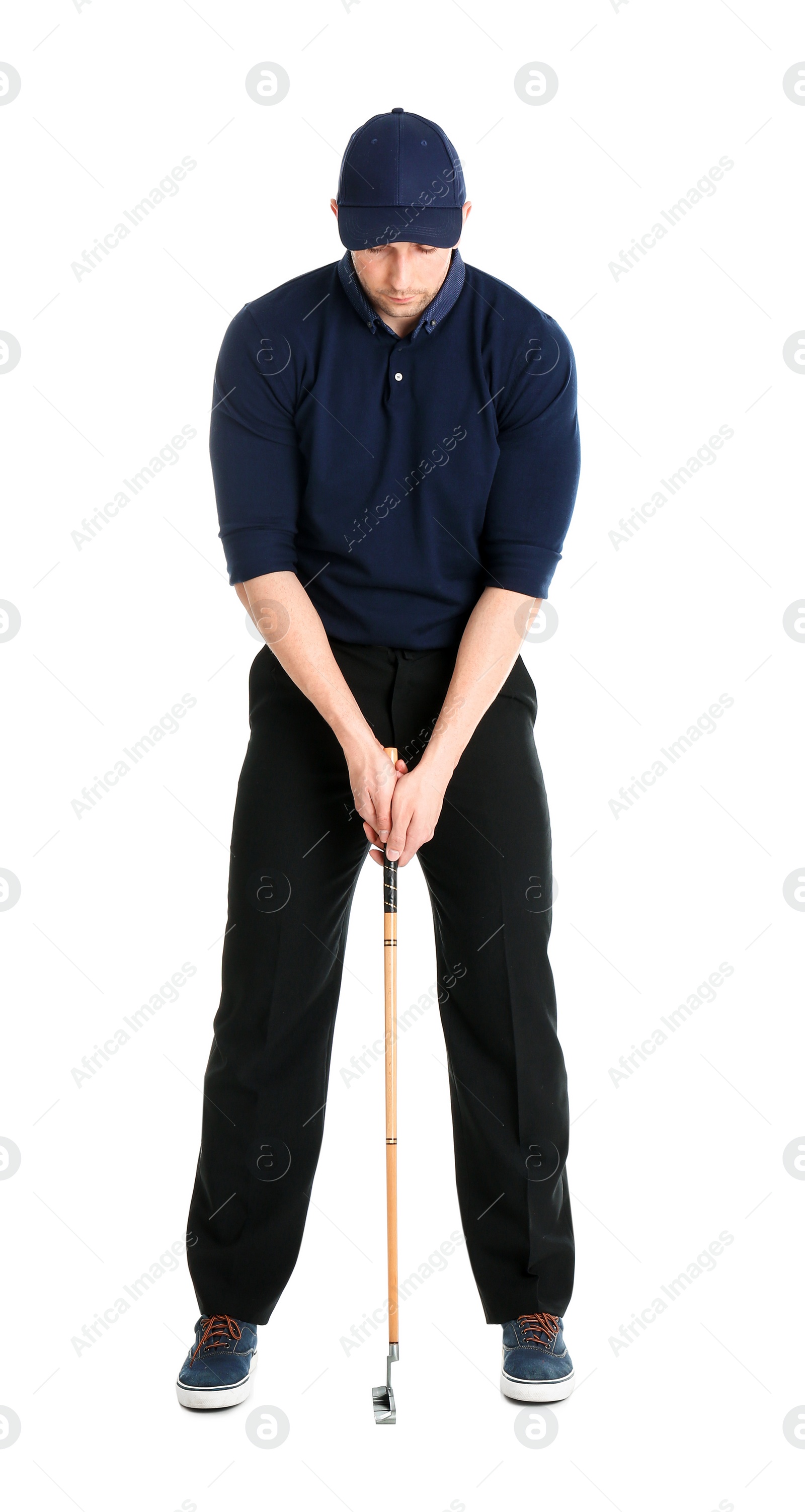 Photo of Young man with golf club isolated on white