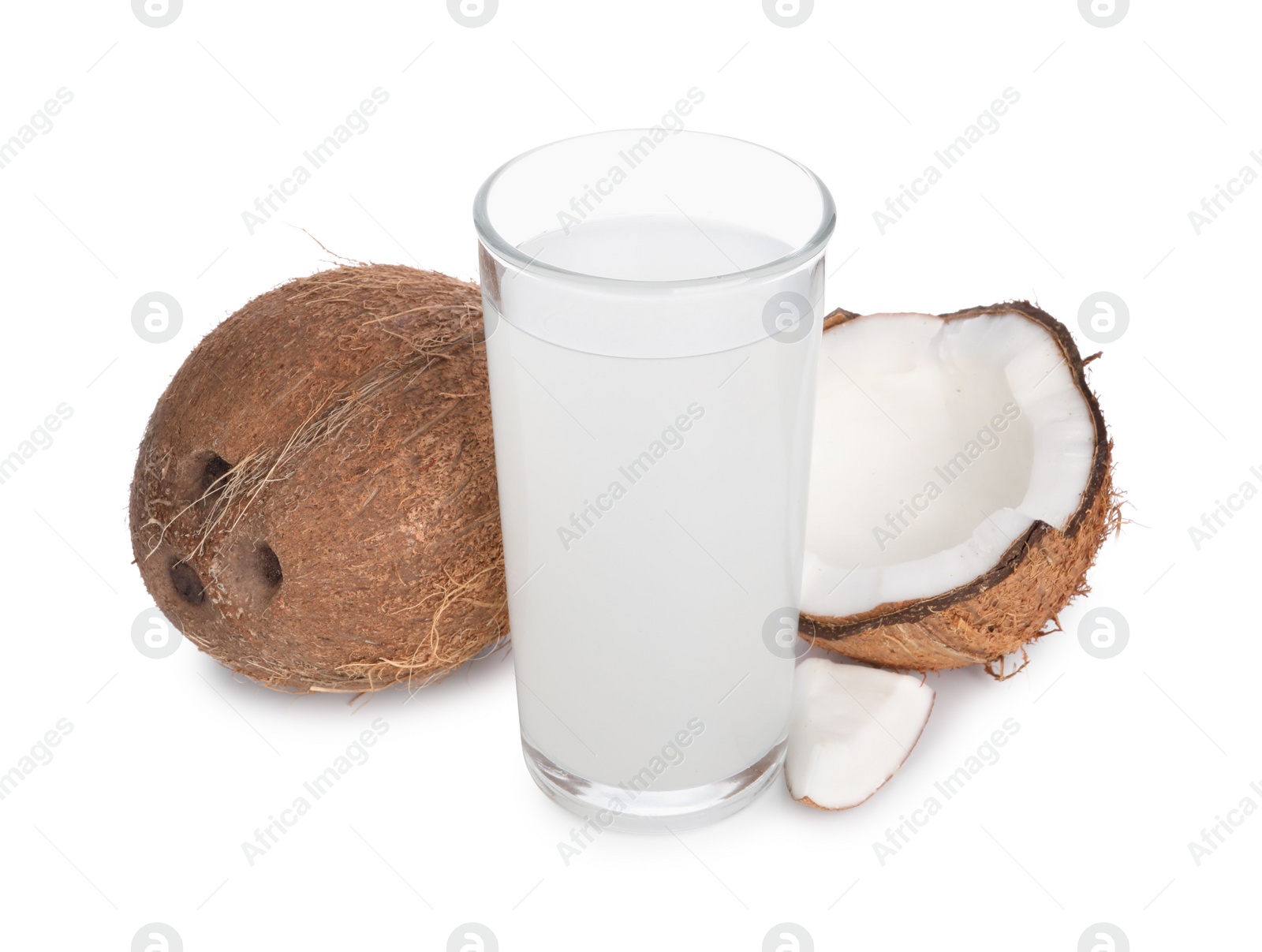 Photo of Glass of coconut water and nuts isolated on white