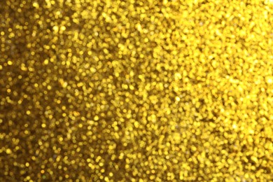 Photo of Shiny golden background with magical bokeh effect
