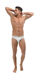 Handsome man in underwear on white background