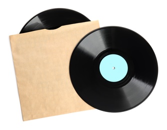 Photo of Vintage vinyl records in paper cover on white background, top view