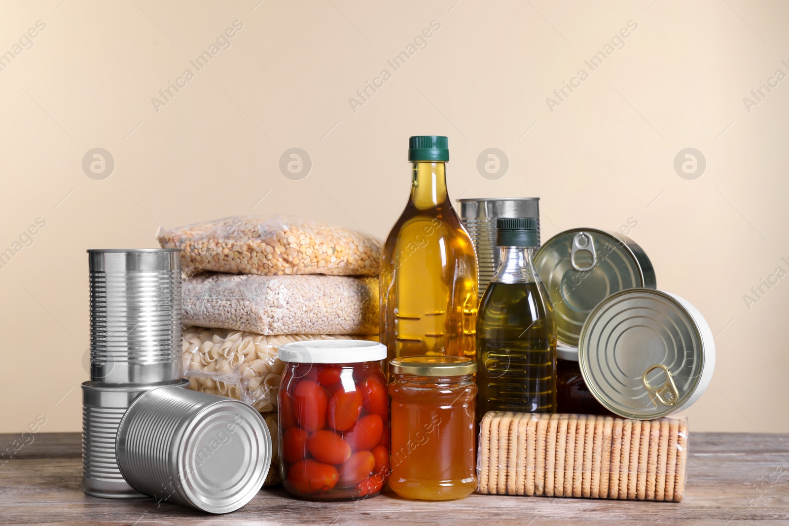 Photo of Different products on wooden table. Food donation