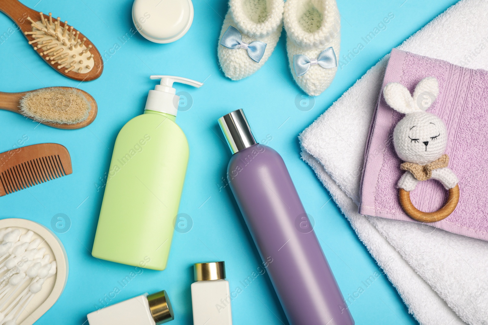 Photo of Flat lay composition with baby cosmetic products on light blue background