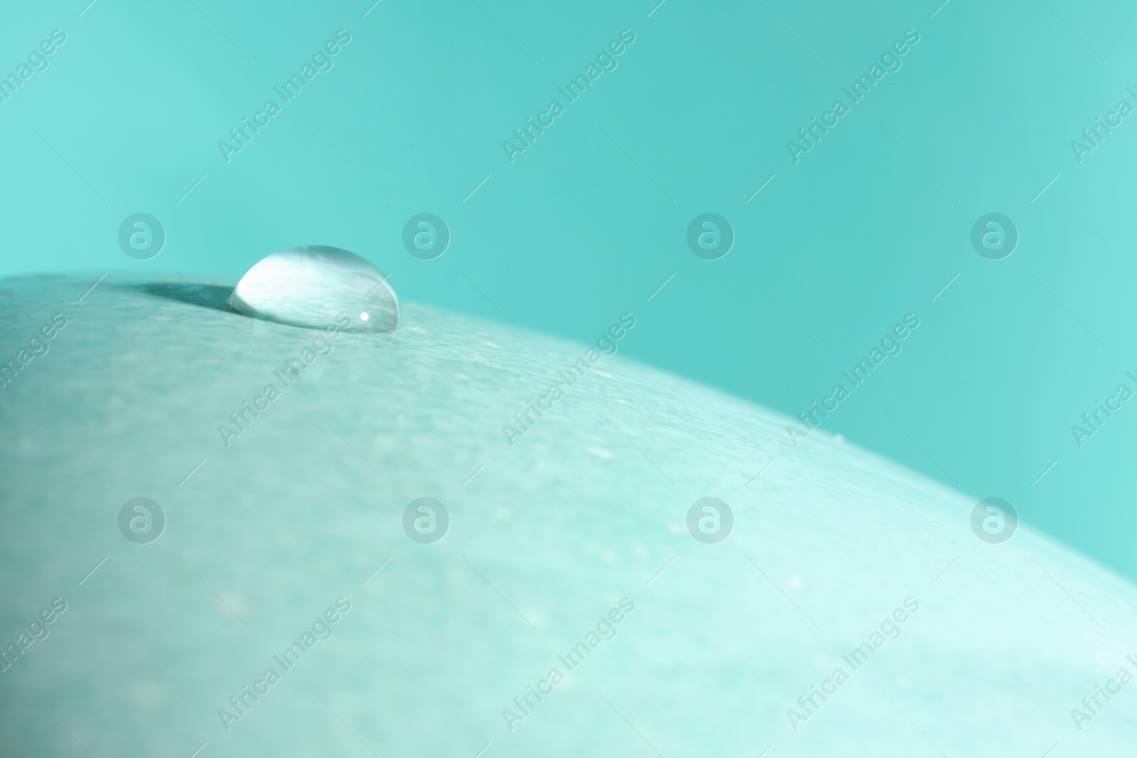 Photo of Macro photo of water drop on turquoise background. Space for text