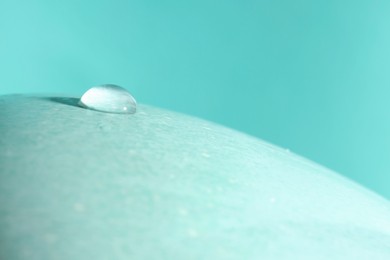 Photo of Macro photowater drop on turquoise background. Space for text