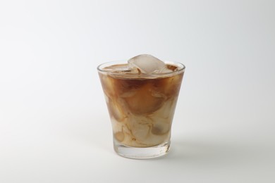 Photo of Iced coffee with milk in glass on white background