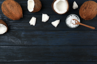 Photo of Flat lay composition with coconut oil on dark wooden table, space for text. Cooking ingredients