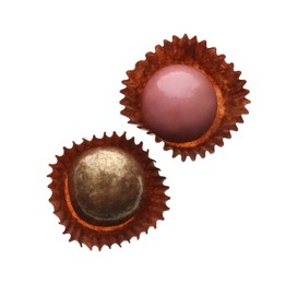 Delicious chocolate candies on white background, top view