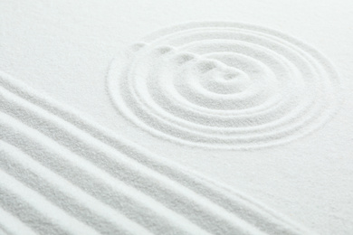 Photo of White sand with pattern. Zen and harmony