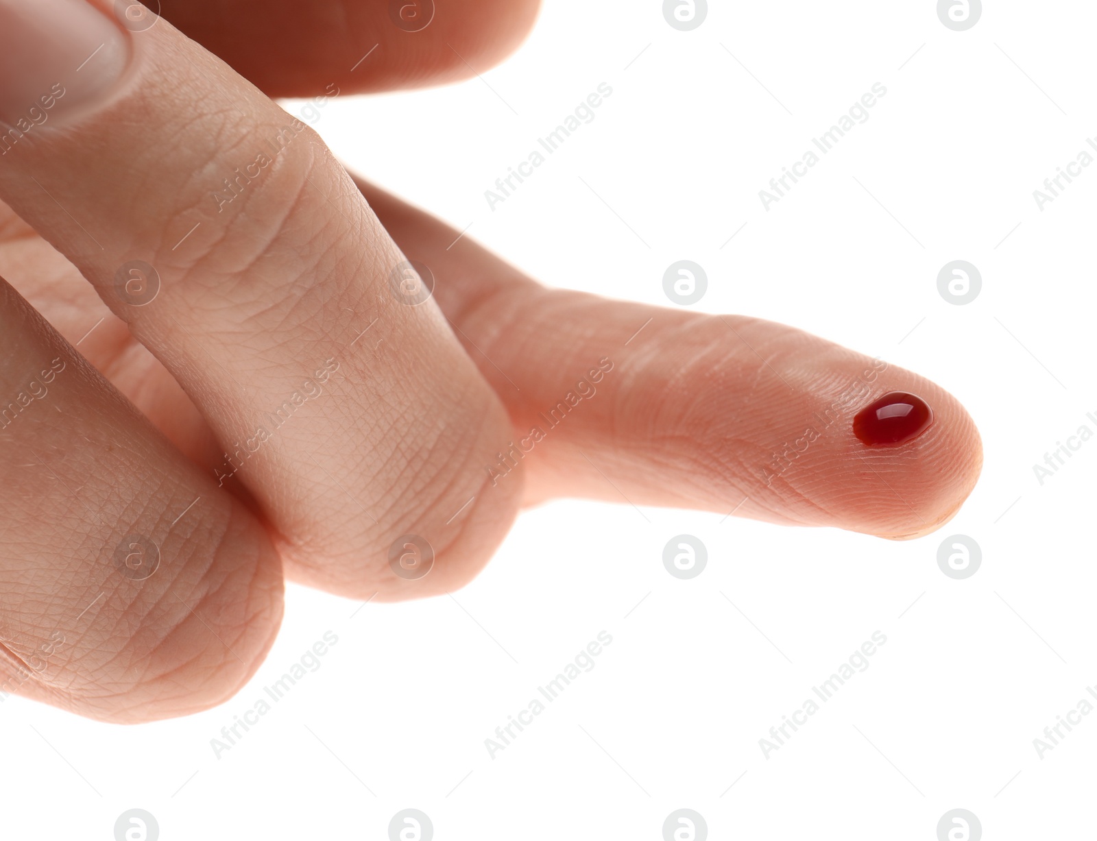 Photo of Woman with pricked finger and blood drop on white background, closeup