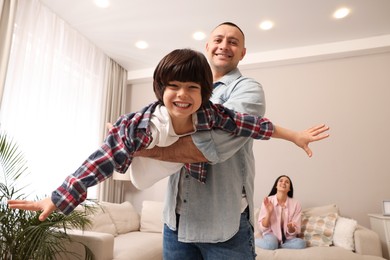 Photo of Happy family spending time together at home