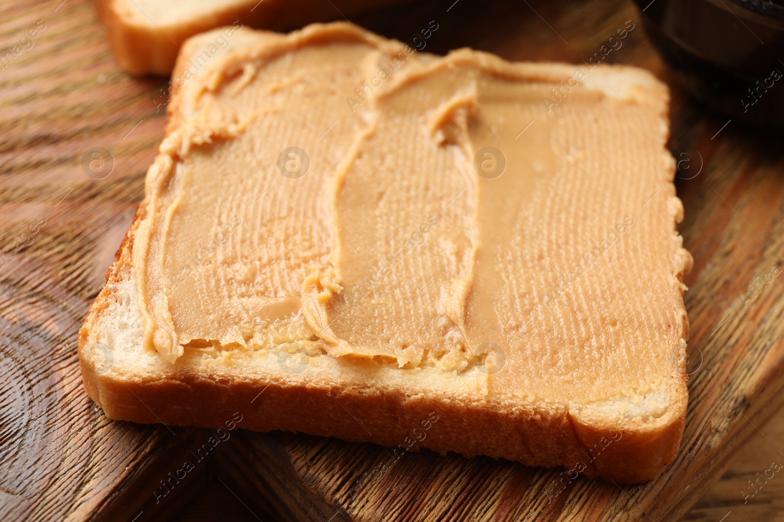 Photo of Tasty peanut butter sandwich on table, closeup view