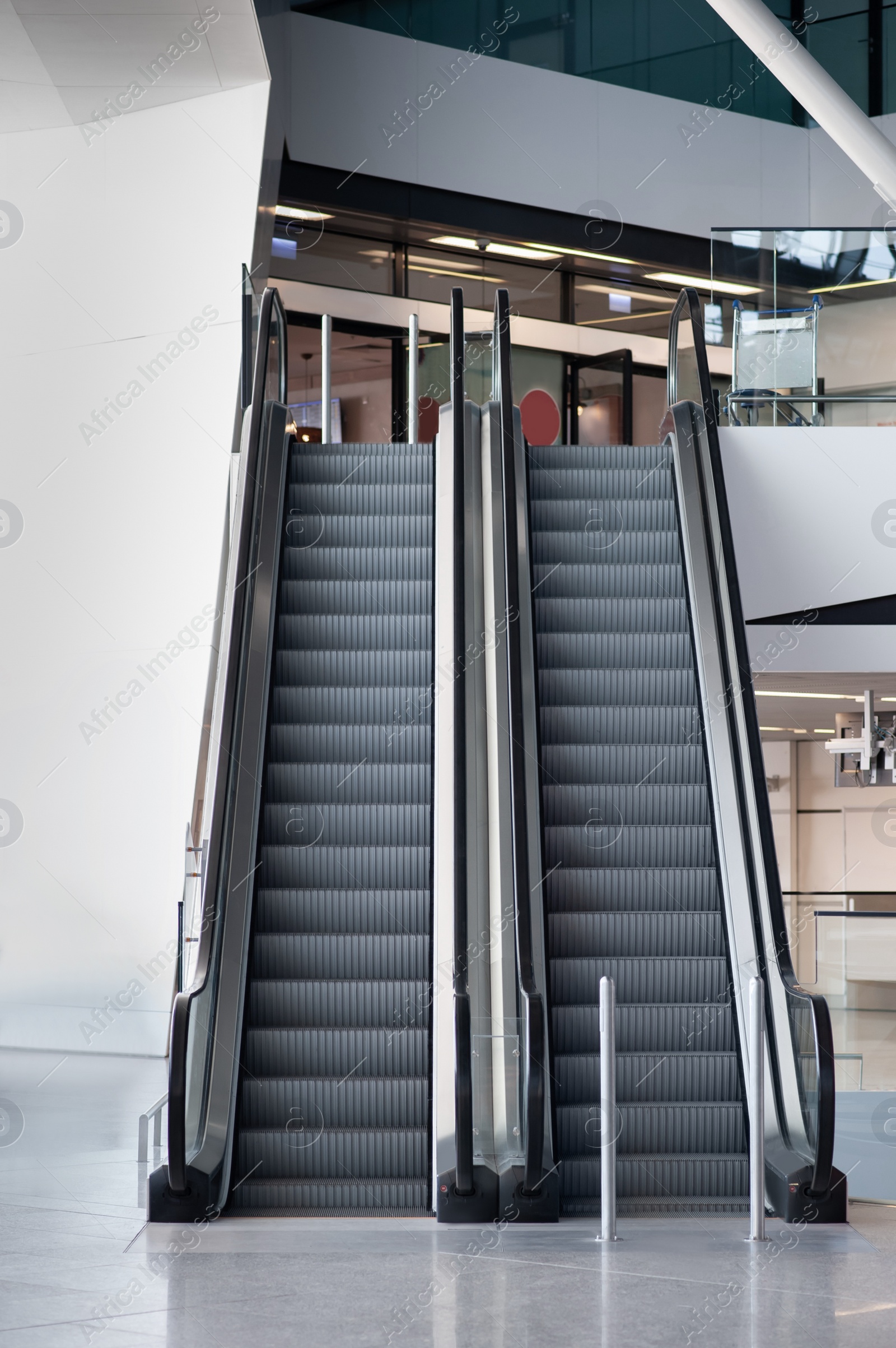 Photo of Interior of new airport terminal with escalators