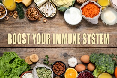 Boost your immune system with proper diet. Different foods on wooden table, flat lay