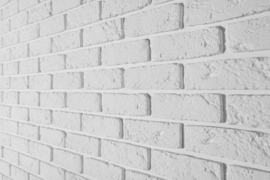 Texture of white brick wall as background, closeup