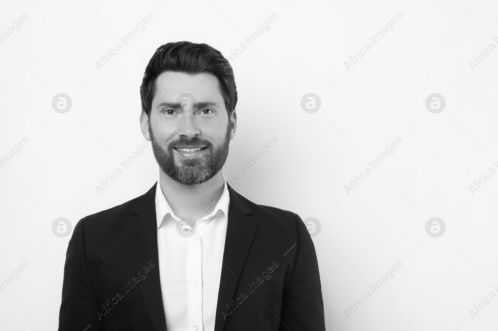 Image of Portrait of handsome man on light background, space for text. Black and white effect