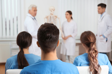 Photo of Medical students having lecture in orthopedics at clinic
