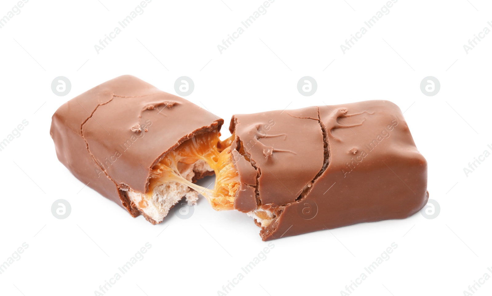 Photo of Broken chocolate bar with caramel, nuts and nougat isolated on white