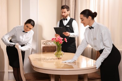 Group of people attending professional butler courses in hotel