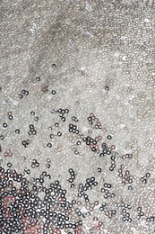 Fabric with beautiful shiny paillettes as background