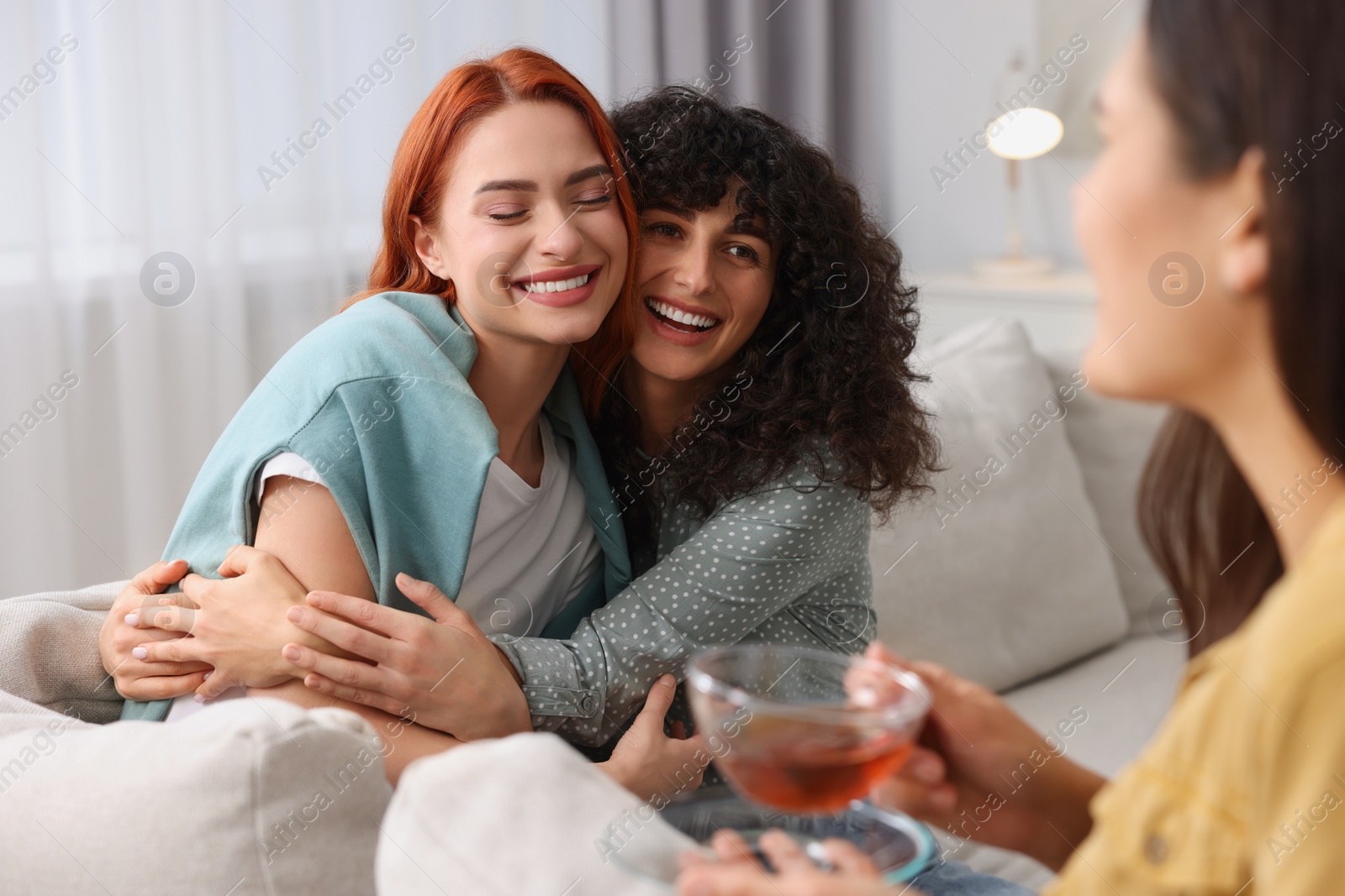 Photo of Happy young friends spending time together at home