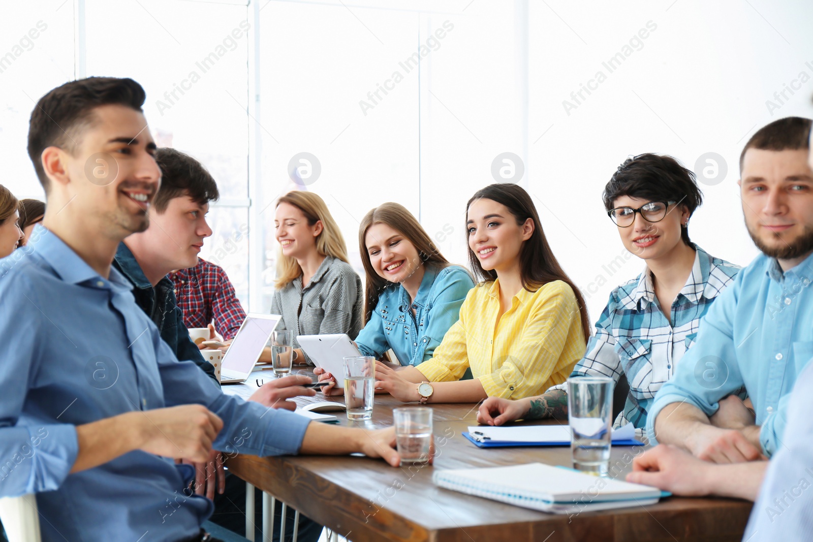 Photo of Young people having business training in office